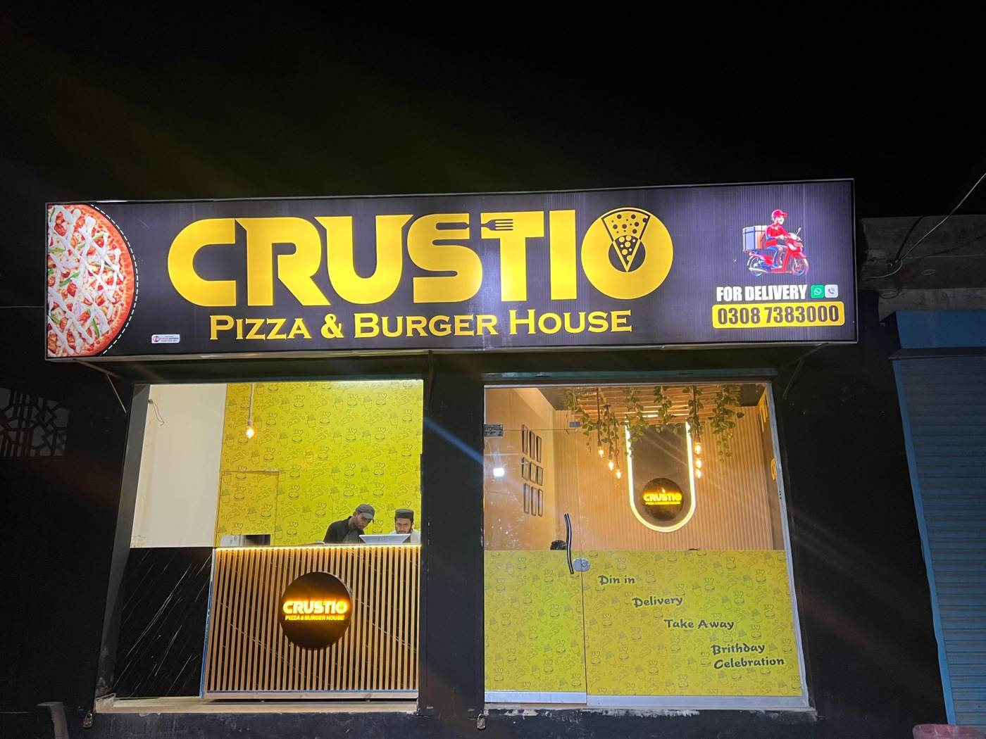CRUSTIO storefront at night